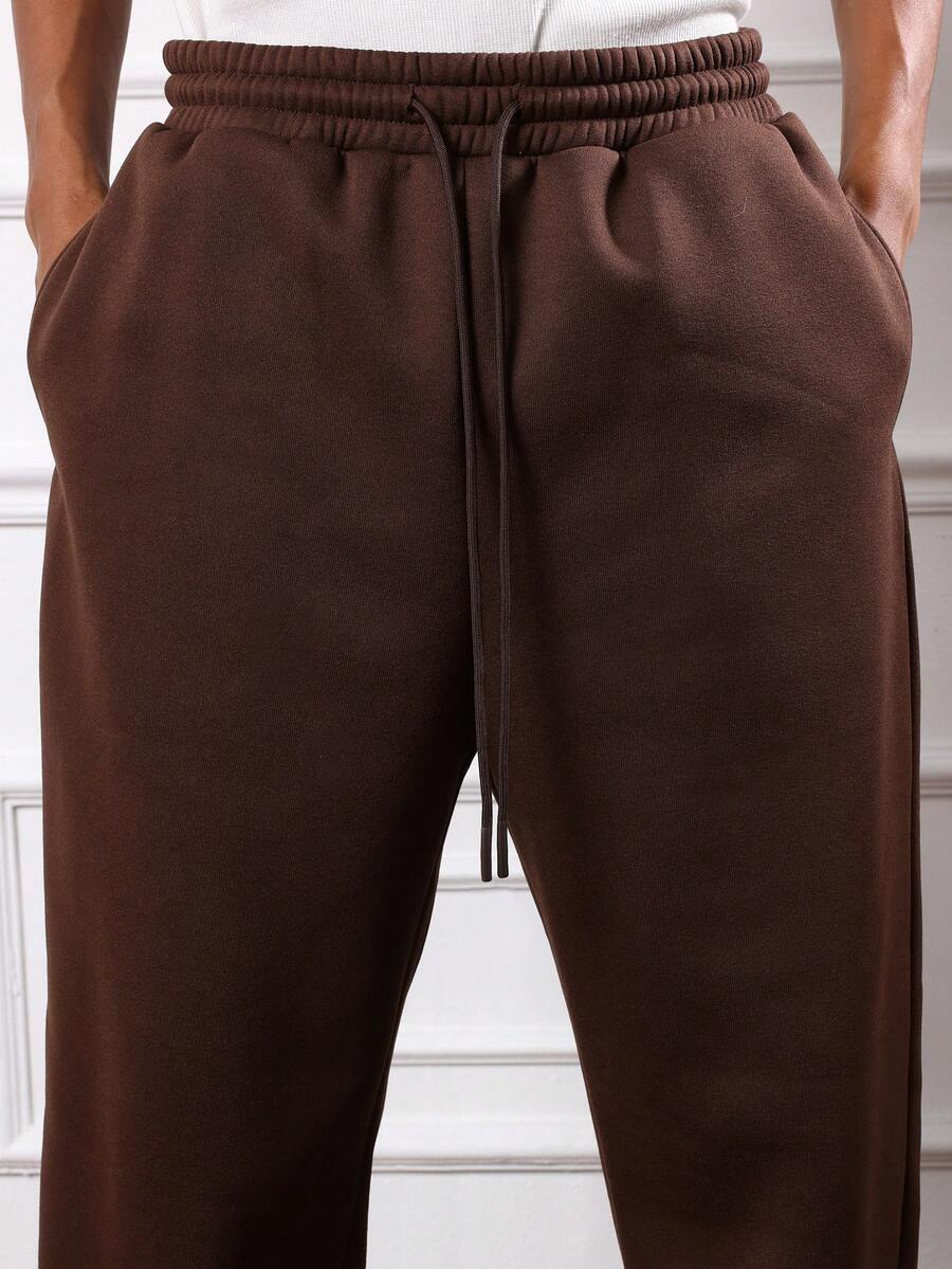 Herren-Trainingsanzug mit Kapuze und halbem Reißverschluss sowie Hose mit Kordelzug