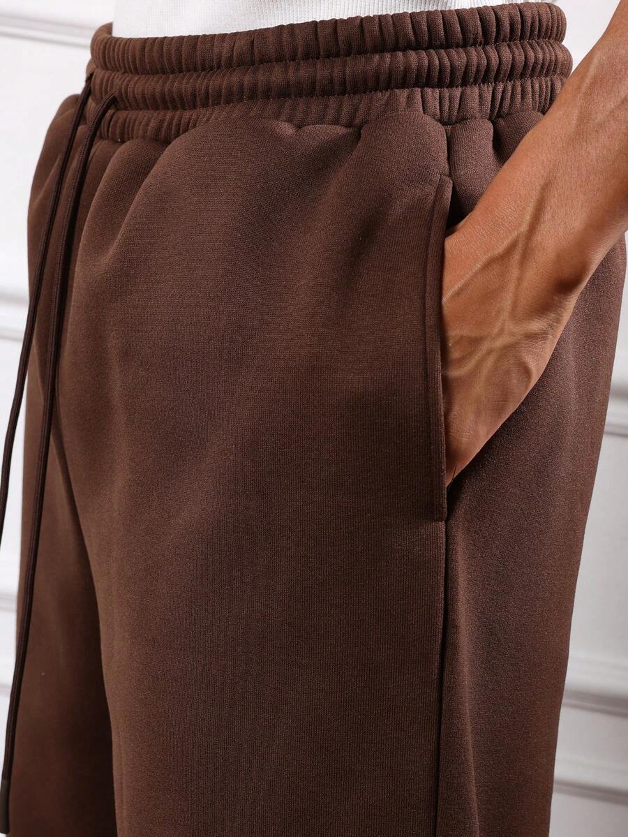Herren-Trainingsanzug mit Kapuze und halbem Reißverschluss sowie Hose mit Kordelzug