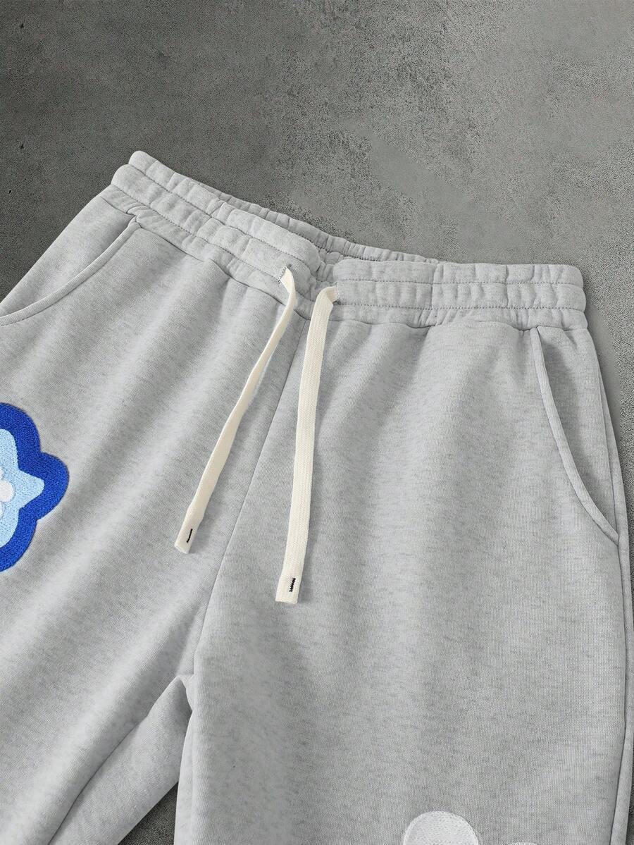 Herren-Trainingsanzug mit Kapuze, Blumenprint und Hose mit Taschen