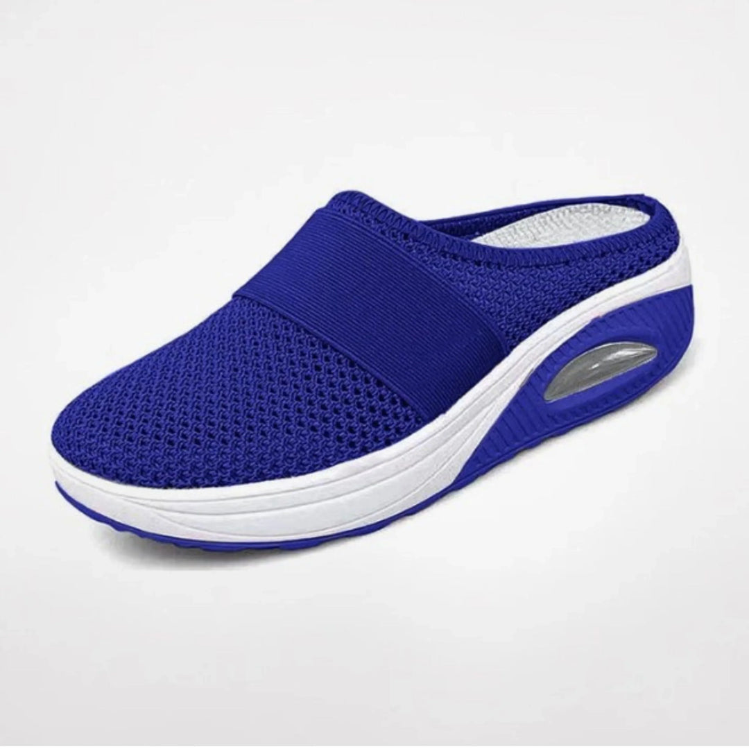 Chaussons Marguerite pour femme ergonomiques avec semelle antidérapante, soutien optimal pour la maison et les promenades douces.