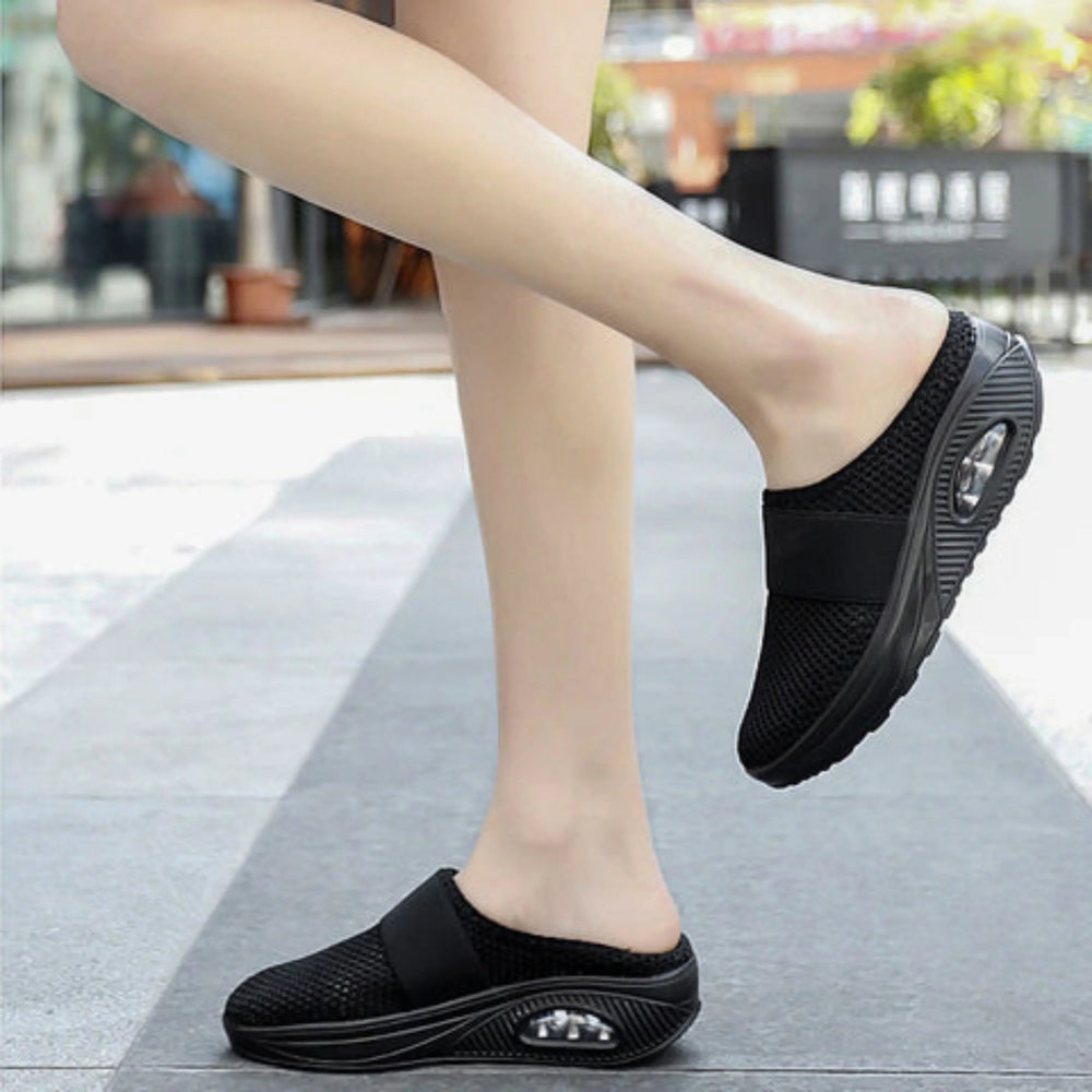 Chaussons Marguerite pour femme ergonomiques avec semelle antidérapante, soutien optimal pour la maison et les promenades douces.