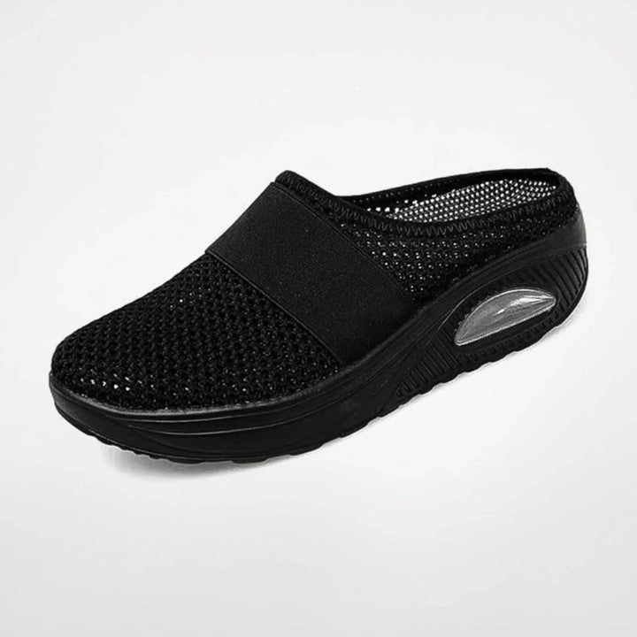 Chaussons Marguerite pour femme ergonomiques avec semelle antidérapante, soutien optimal pour la maison et les promenades douces.
