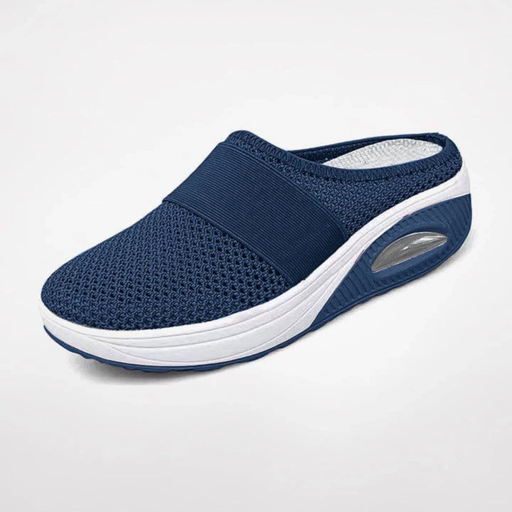 Chaussons Marguerite pour femme ergonomiques avec semelle antidérapante, soutien optimal pour la maison et les promenades douces.