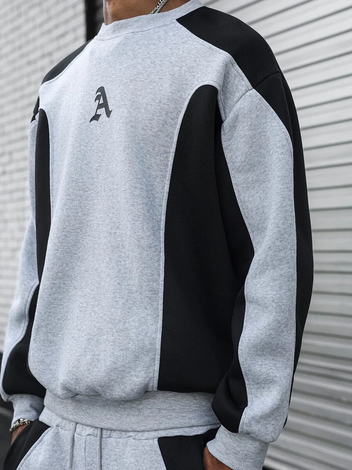 Men's two-tone tracksuit set with crew-neck top and wide-leg pants