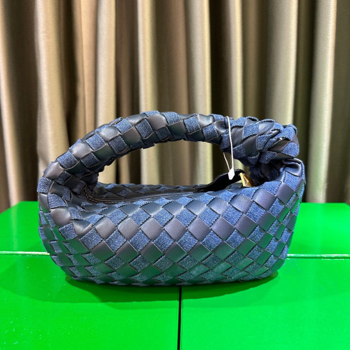 Women's denim and braided leather tote bag with handles