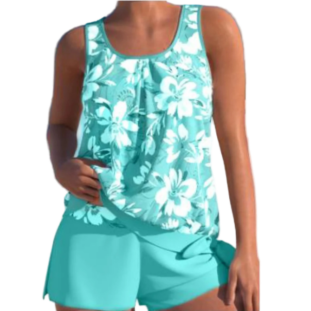 Le tankini Angélique pour femme, au design tendance, avec un haut à imprimé floral dans des tons turquoise. Il est accompagné d'un short assorti, parfait pour les journées ensoleillées à la plage ou au bord de la piscine.