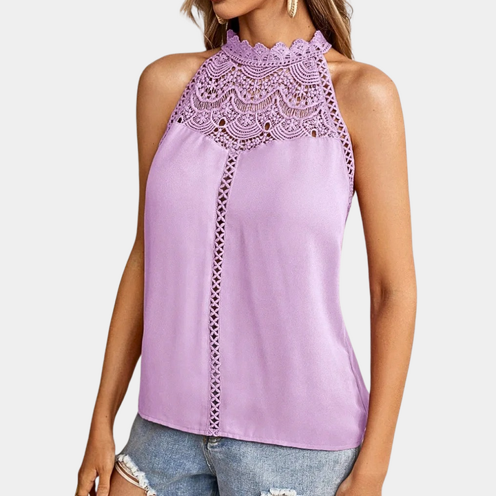 Débardeur Anissa pour femme, d'un joli violet pastel, avec un col haut et une dentelle délicate. Ce modèle moderne et élégant est parfait pour un look estival raffiné, alliant confort et style.
