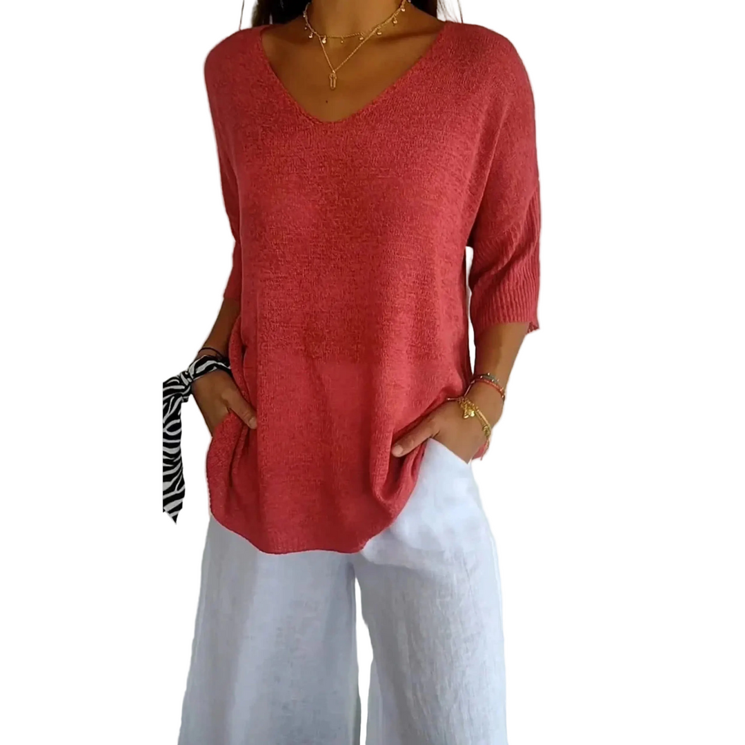 Le top en tricot Annabelle pour femme, au design moderne et élégant. Ce modèle présente un col en V et des manches 3/4, dans une teinte rose douce. Il est parfait pour une tenue décontractée et chic, à porter avec un pantalon léger ou un jean.