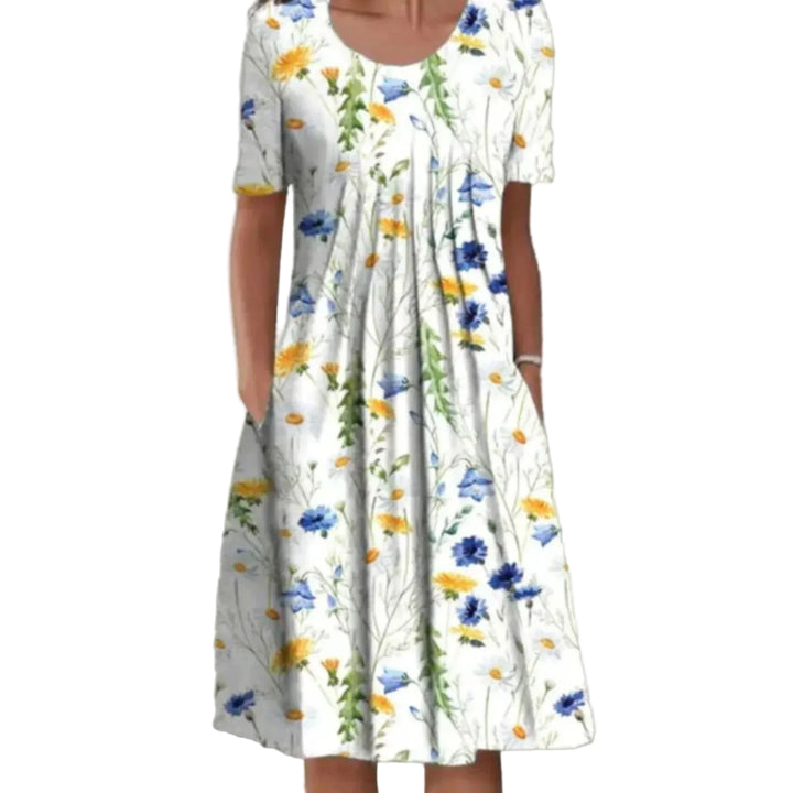 Robe légère et élégante avec motif floral coloré, idéale pour la saison estivale. Parfaite pour un look frais et féminin, avec une coupe confortable et moderne.