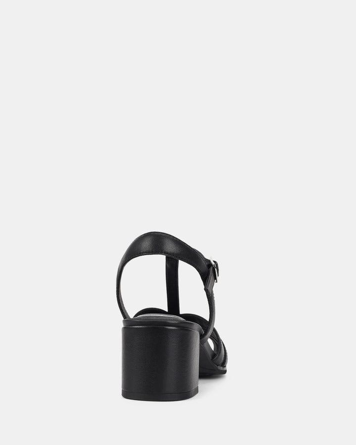 Vue arrière des sandales à bride cheville et talon bloc pour femmes. Détail de la bride ajustable avec boucle métallique et talon bloc stable, offrant confort et soutien pour une allure moderne et élégante.
