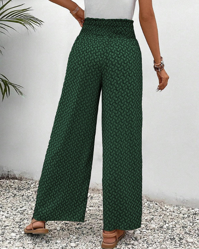 pantalon à coupe large avec taille élastiquée et motif géométrique vert, vue arrière montrant la coupe fluide et élégante, idéal pour un look décontracté et moderne.