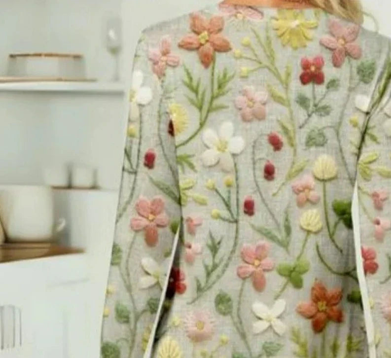 Vue de dos du pull à manches longues avec imprimé floral multicolore et finitions en relief, style printemps.