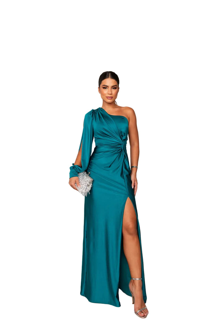 Cette robe bleu-vert éclatante, avec une épaule unique et un détail noué à la taille, offre une silhouette élégante et moderne. La fente sur le côté ajoute une touche de sensualité, tandis que le sac à main scintillant et les sandales à talons complètent parfaitement cette tenue chic et sophistiquée, idéale pour vos occasions spéciales.