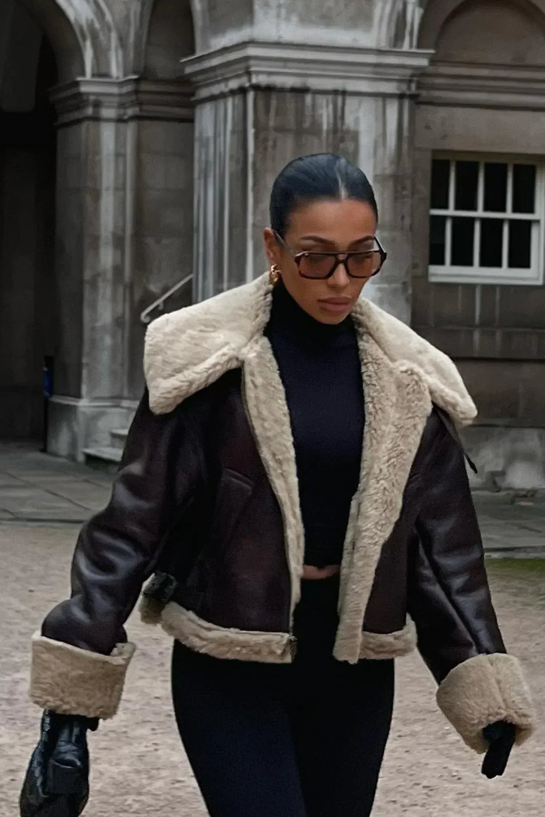 Women's genuine lambskin leather jacket in black with faux fur collar