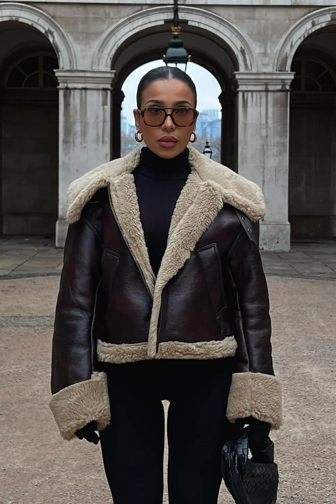 Women's genuine lambskin leather jacket in black with faux fur collar