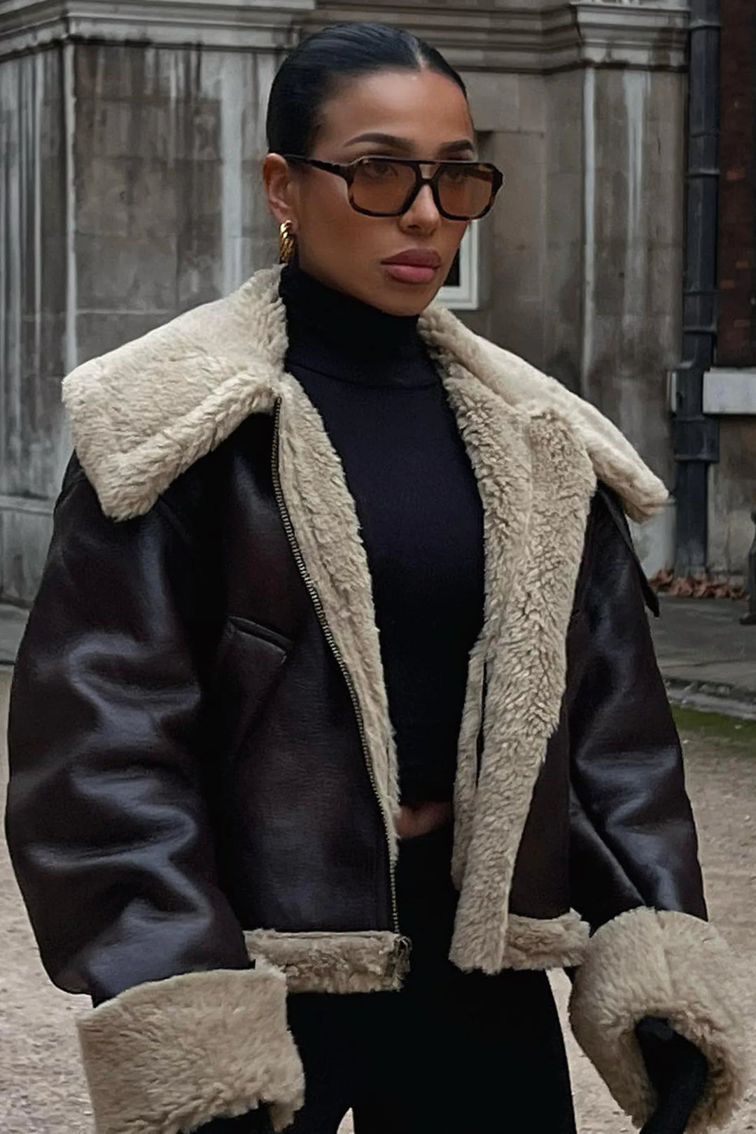 Women's genuine lambskin leather jacket in black with faux fur collar