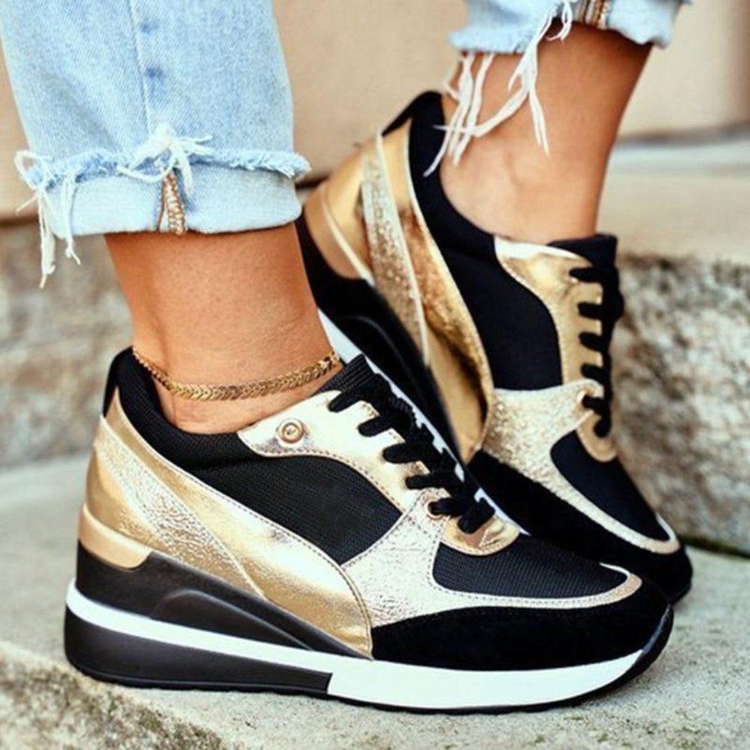 Baskets Léonie pour femme à talons ajustés, finitions raffinées et coupe étudiée pour une allure polyvalente et soignée.