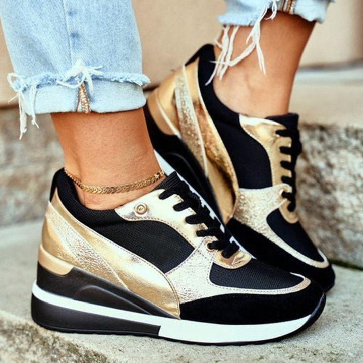 Baskets Léonie pour femme à talons ajustés, finitions raffinées et coupe étudiée pour une allure polyvalente et soignée.