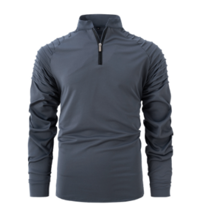 Polo à manches longues pour homme, de couleur gris anthracite avec un col zippé et des détails texturés sur les épaules. Ce modèle élégant et contemporain est idéal pour un look sportif et moderne.