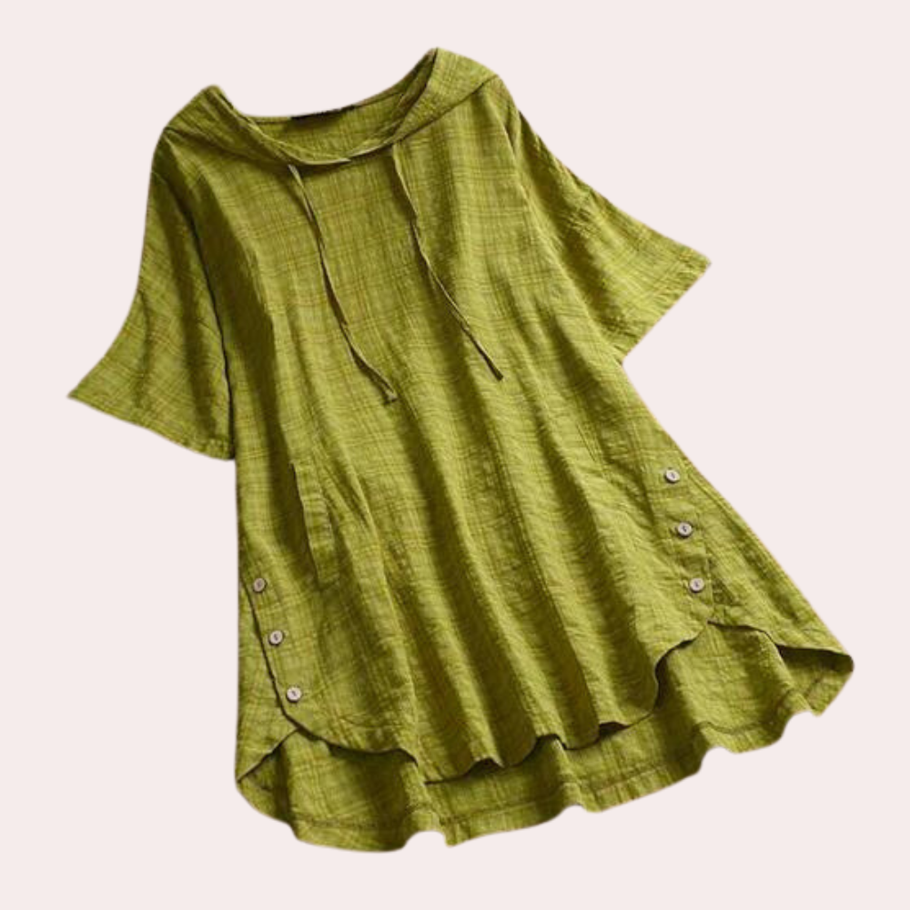 Chemisier long ample Jihane pour femme, au style moderne et décontracté. Ce modèle vert à manches courtes, avec une capuche et des boutons sur les côtés, offre une coupe fluide et légère, idéale pour un look confortable et stylé au quotidien.