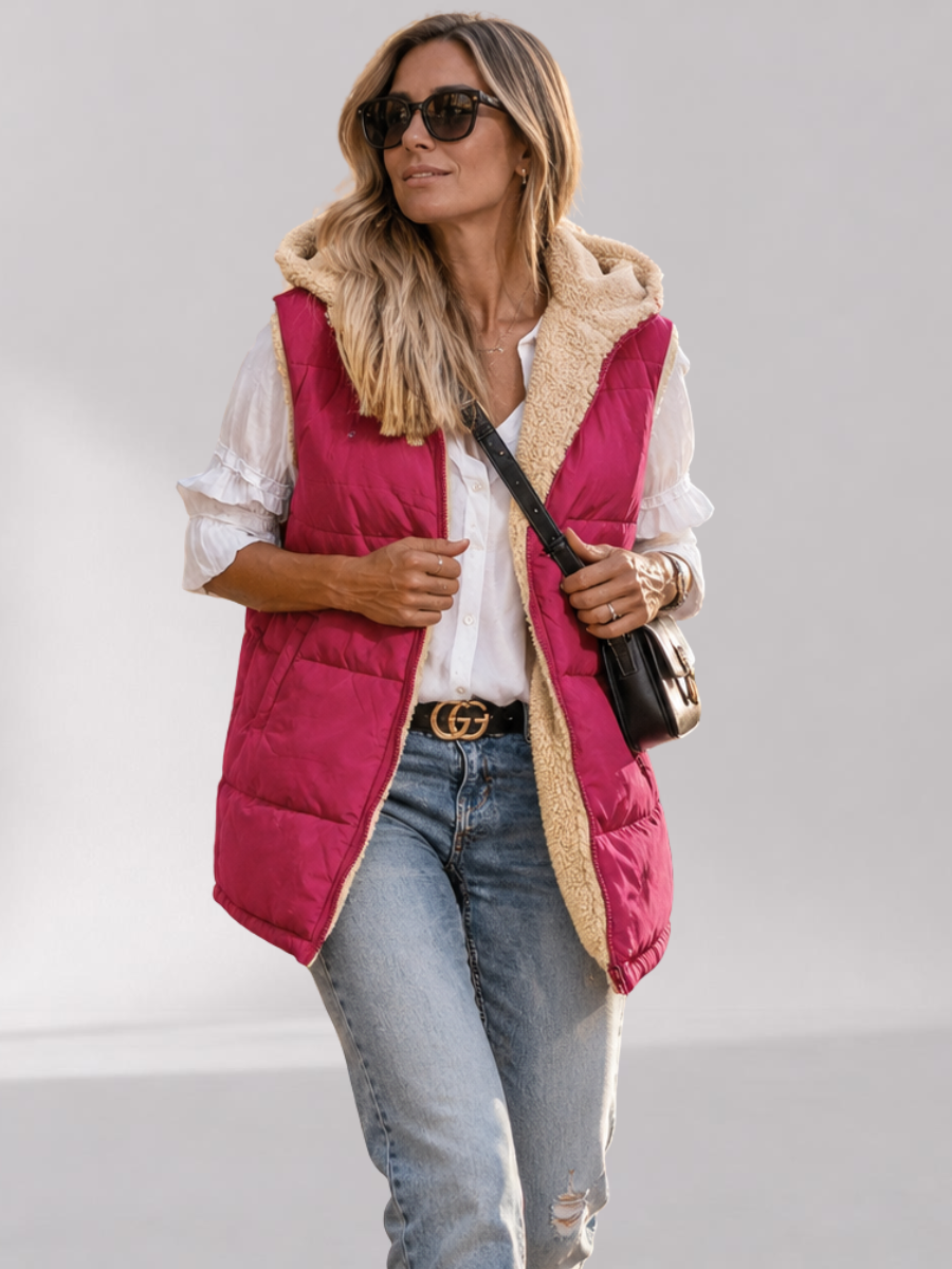Lange damesbodywarmer - omkeerbaar met sherpavoering en capuchon