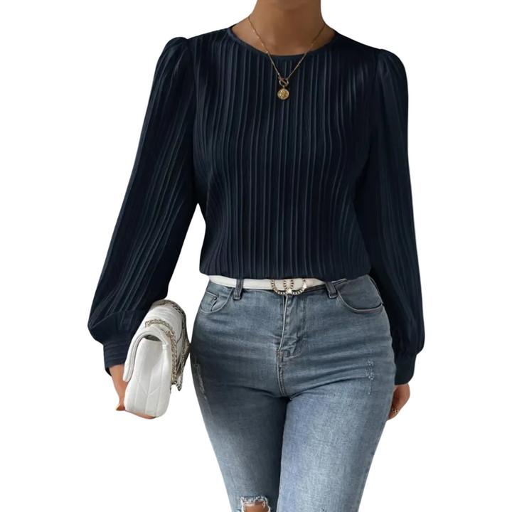 Haut à manches longues Mouna pour femme, au design tendance et sophistiqué. Ce top à fines plis, avec une coupe moderne et élégante, se combine parfaitement avec un jean pour un look chic et décontracté. Idéal pour un style raffiné au quotidien.