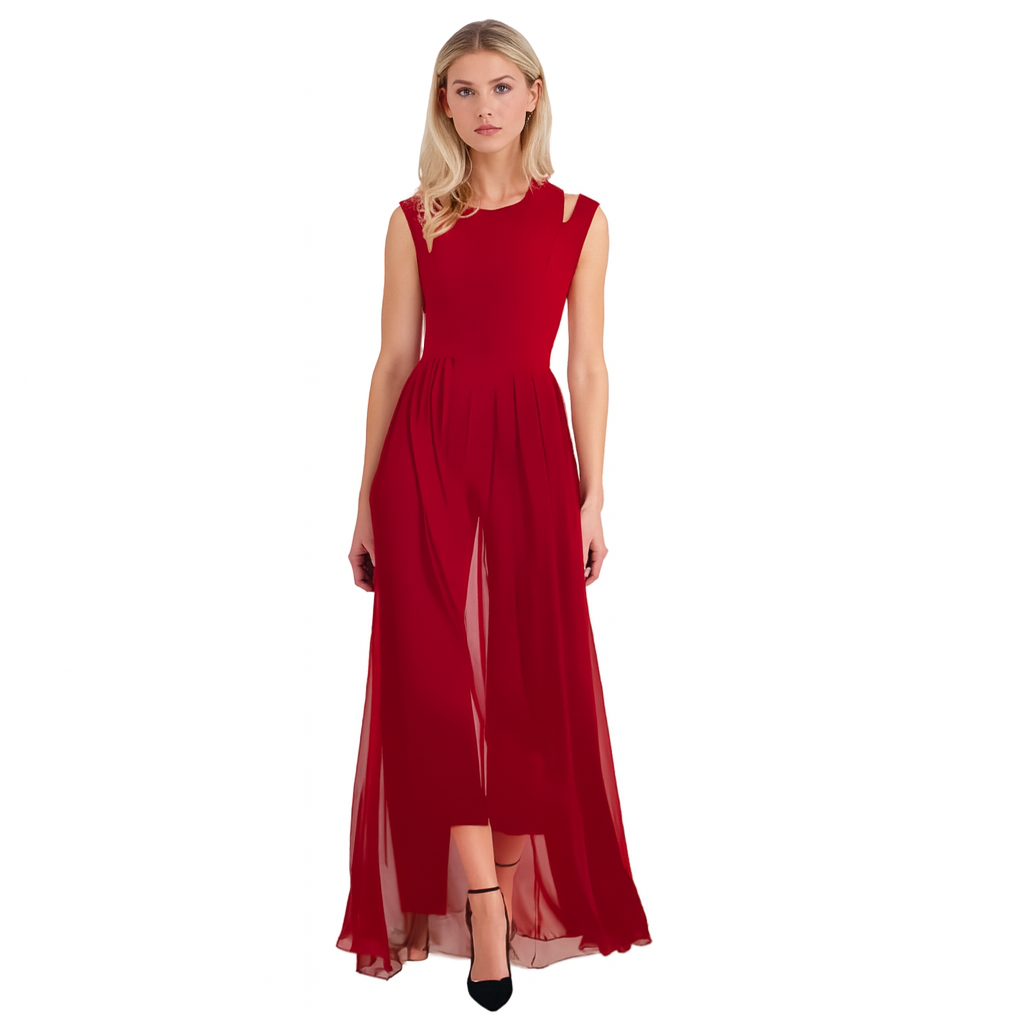 Robe longue et fluide pour femme, en rouge vif, avec un haut ajusté et une jupe ample qui tombe gracieusement jusqu'aux pieds. La robe présente des détails élégants au niveau des épaules et une coupe moderne. Elle est portée avec des chaussures noires à talons fins, créant un look chic et sophistiqué.