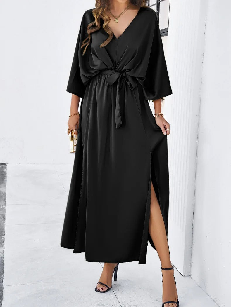 Robe midi à col en V pour femme, élégante et tendance, parfaite pour la saison printanière. Son design fluide et son détail de fente sur le côté apportent une touche moderne et sophistiquée. Idéale pour des occasions décontractées ou habillées, cette robe noire saura sublimer votre silhouette avec style.