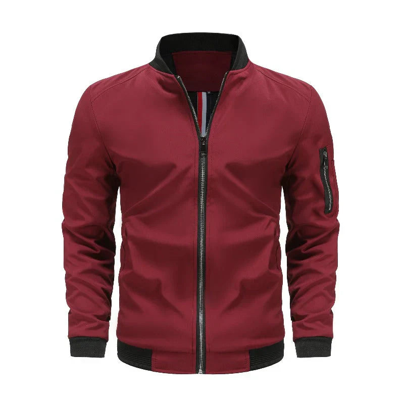 Veste bomber zippée homme Philippe moderne bordeaux, col et poignets côtelés noirs, fermeture éclair centrale et poche zippée sur la manche, sur fond blanc.