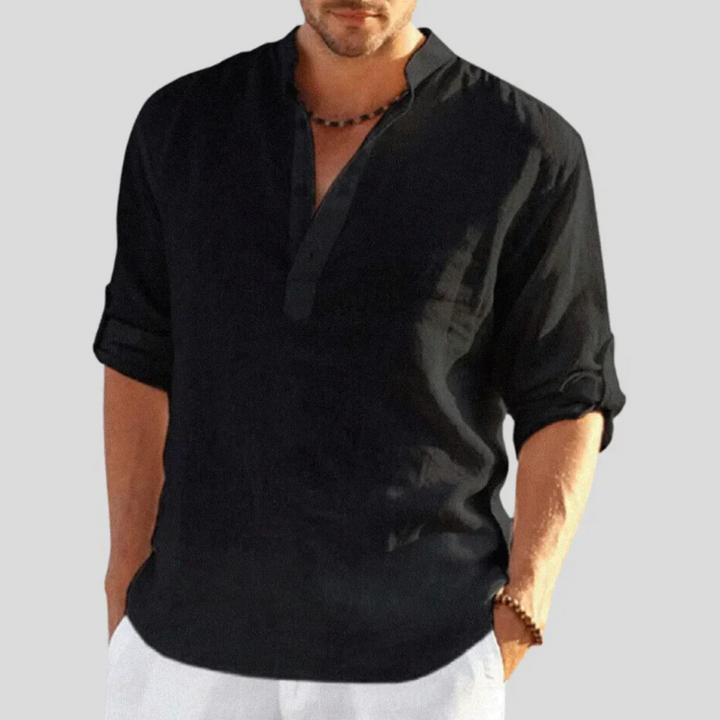 Chemise slim pour homme Sébastien, modèle tendance en lin noir. Avec un col mao et des manches retroussées, cette chemise légère et élégante est idéale pour un look décontracté et raffiné, parfait pour les journées estivales ou les occasions informelles.