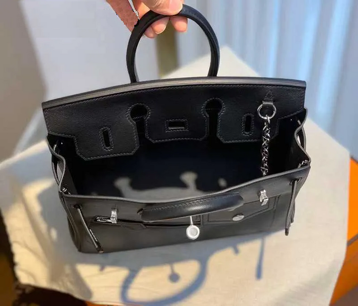 Women's full-grain leather handbag with padlock clasp and chain