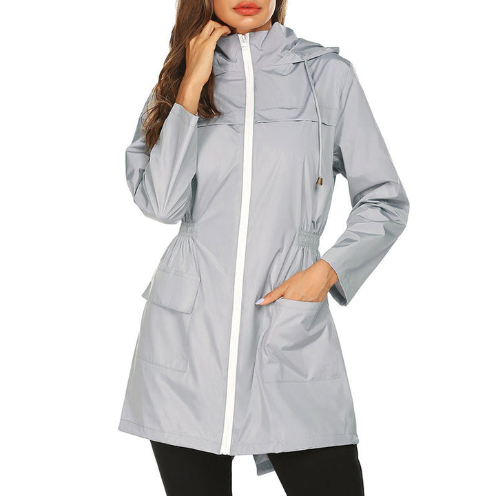 Lichte waterafstotende regenjas voor dames met elastische taille en capuchon