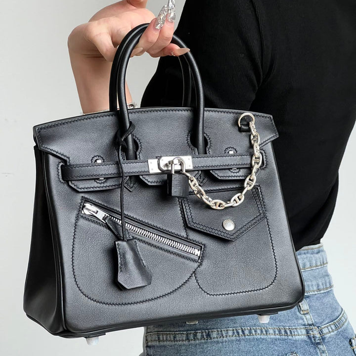 Women's full-grain leather handbag with padlock clasp and chain