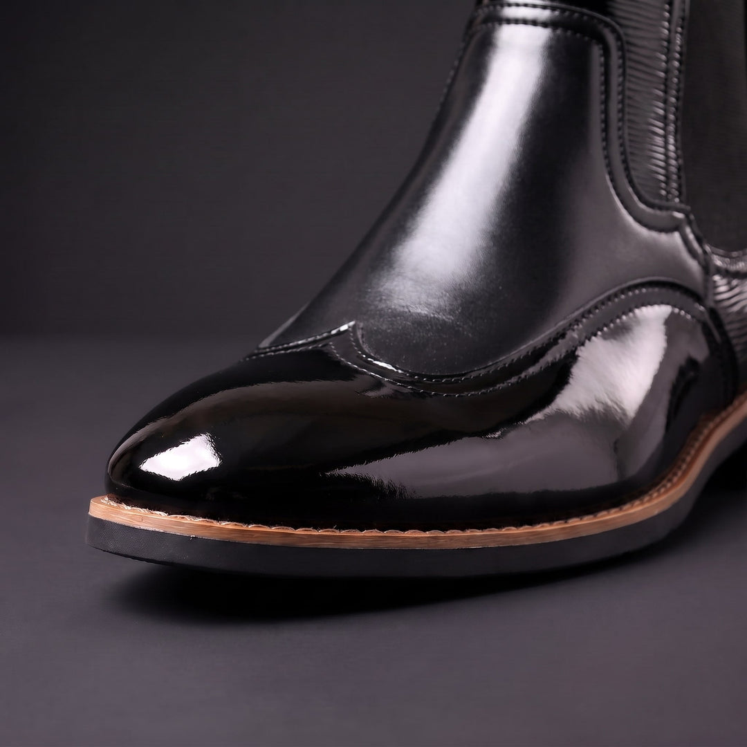 Botas Chelsea de hombre de cuero con elásticos laterales y tiradores