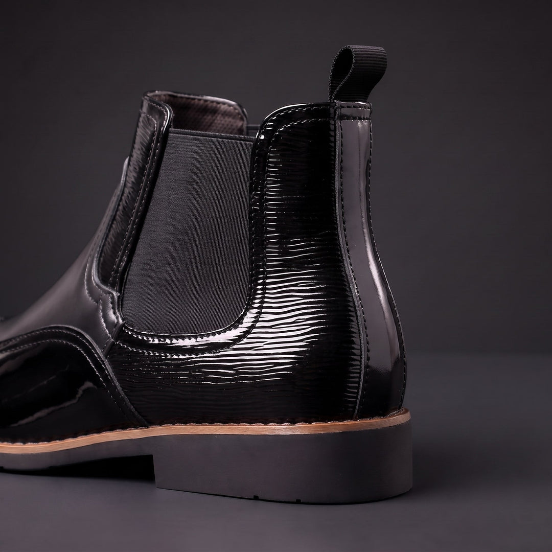 Botas Chelsea de hombre de cuero con elásticos laterales y tiradores