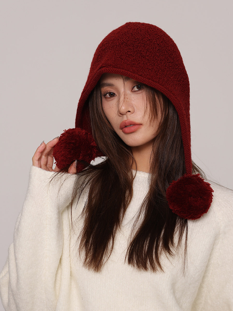 Cappuccio da donna in maglia di pura lana – lacci con pompon