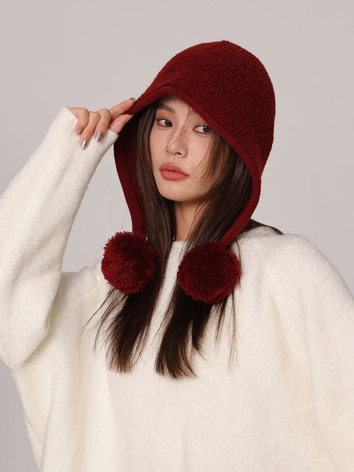 Cappuccio da donna in maglia di pura lana – lacci con pompon