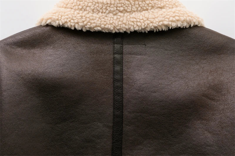 Women's genuine lambskin leather jacket in black with a faux fur collar and belt