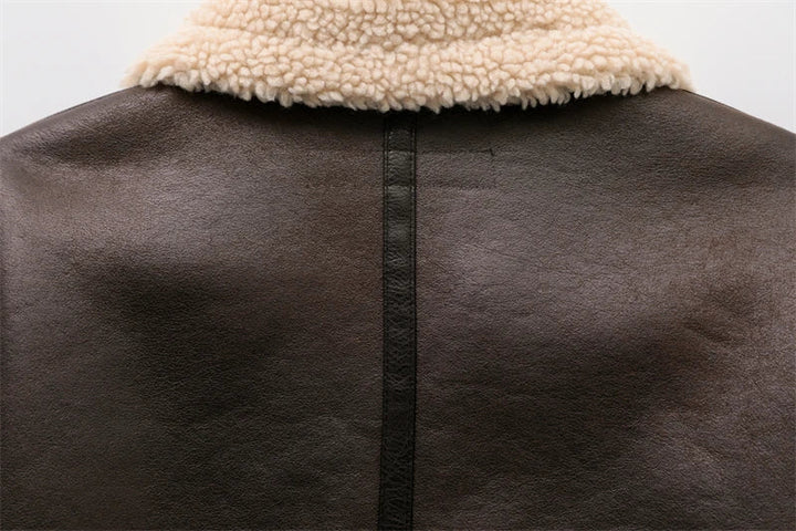 Women's genuine lambskin leather jacket in black with a faux fur collar and belt