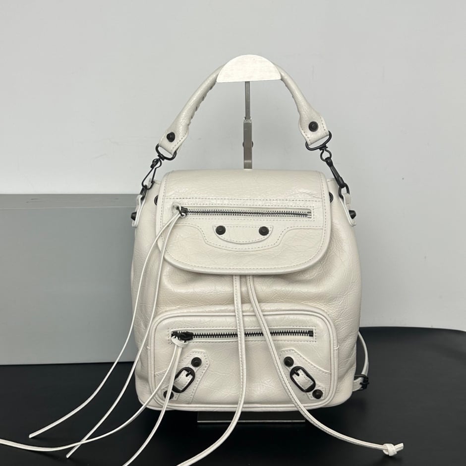 Women's Leather Backpack with Studs, Flap, and Zippered Pockets