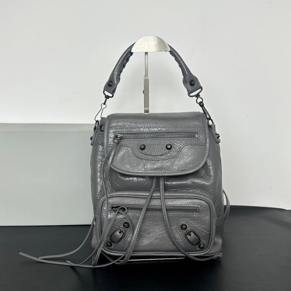 Women's Leather Backpack with Studs, Flap, and Zippered Pockets