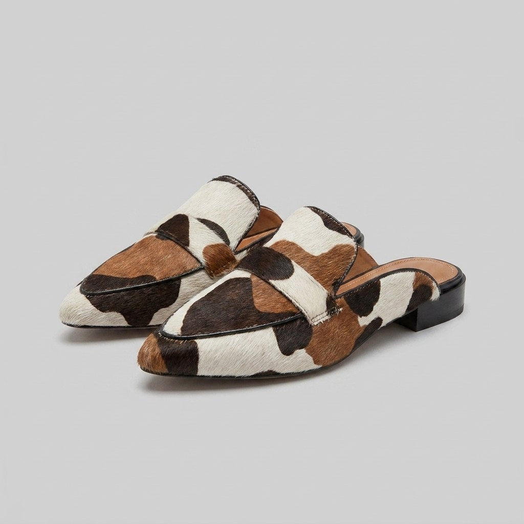 Women's slip-on cow-print mules with a low heel