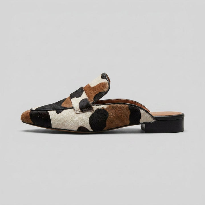 Women's slip-on cow-print mules with a low heel