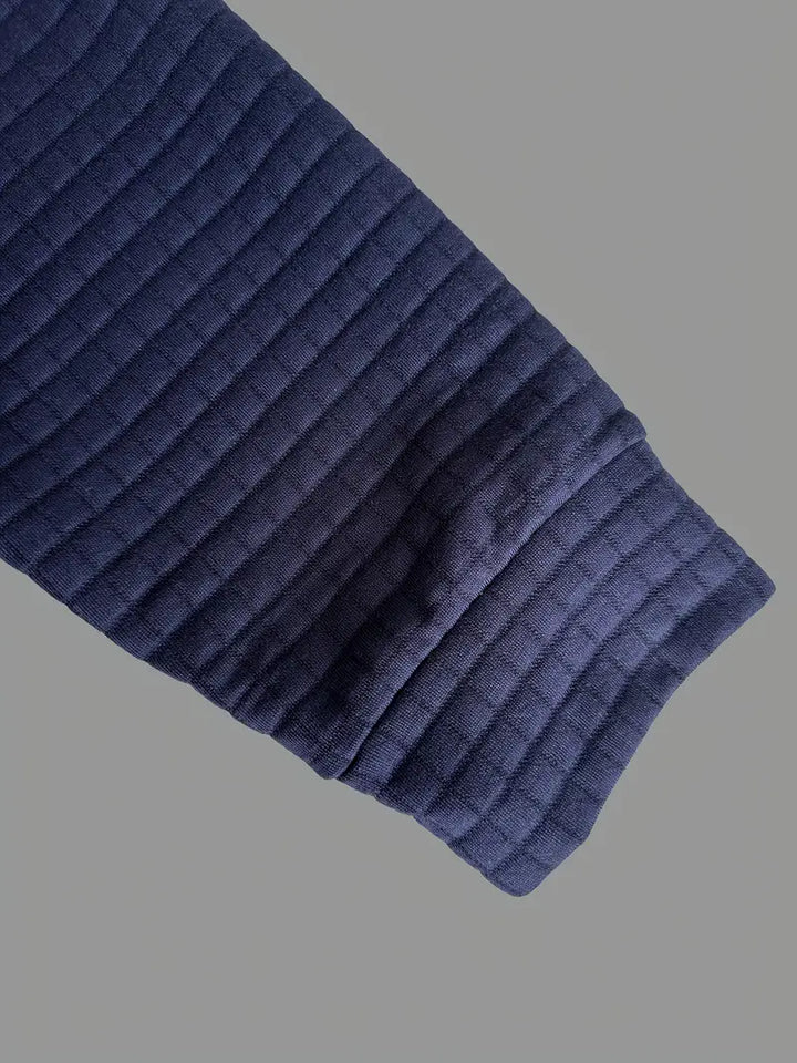 Polo da uomo a maniche lunghe in maglia goffrata con taschino sulla manica